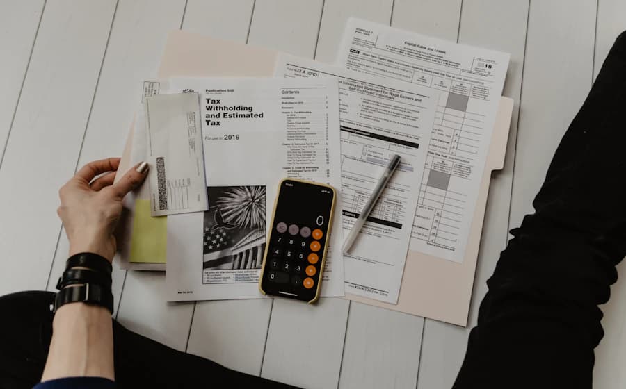 Overhead view of financial documents and a calculator laid out for review